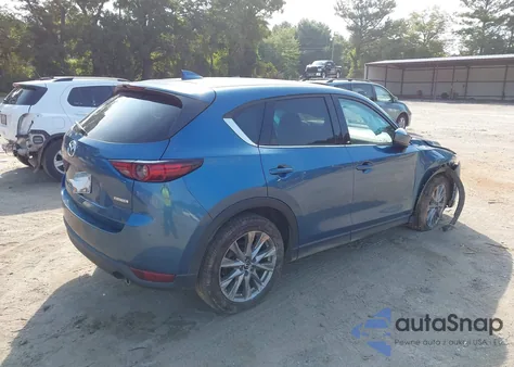 2021 Mazda Cx-5 Grand Touring z USA, uszkodzony, nr VIN JM3KFBDM5M0343058